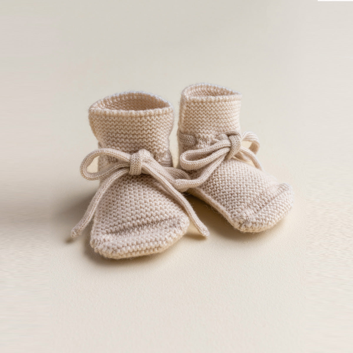 HVID Knitted Baby Booties made of extra fine Italian merino wool in a charming cotton bag