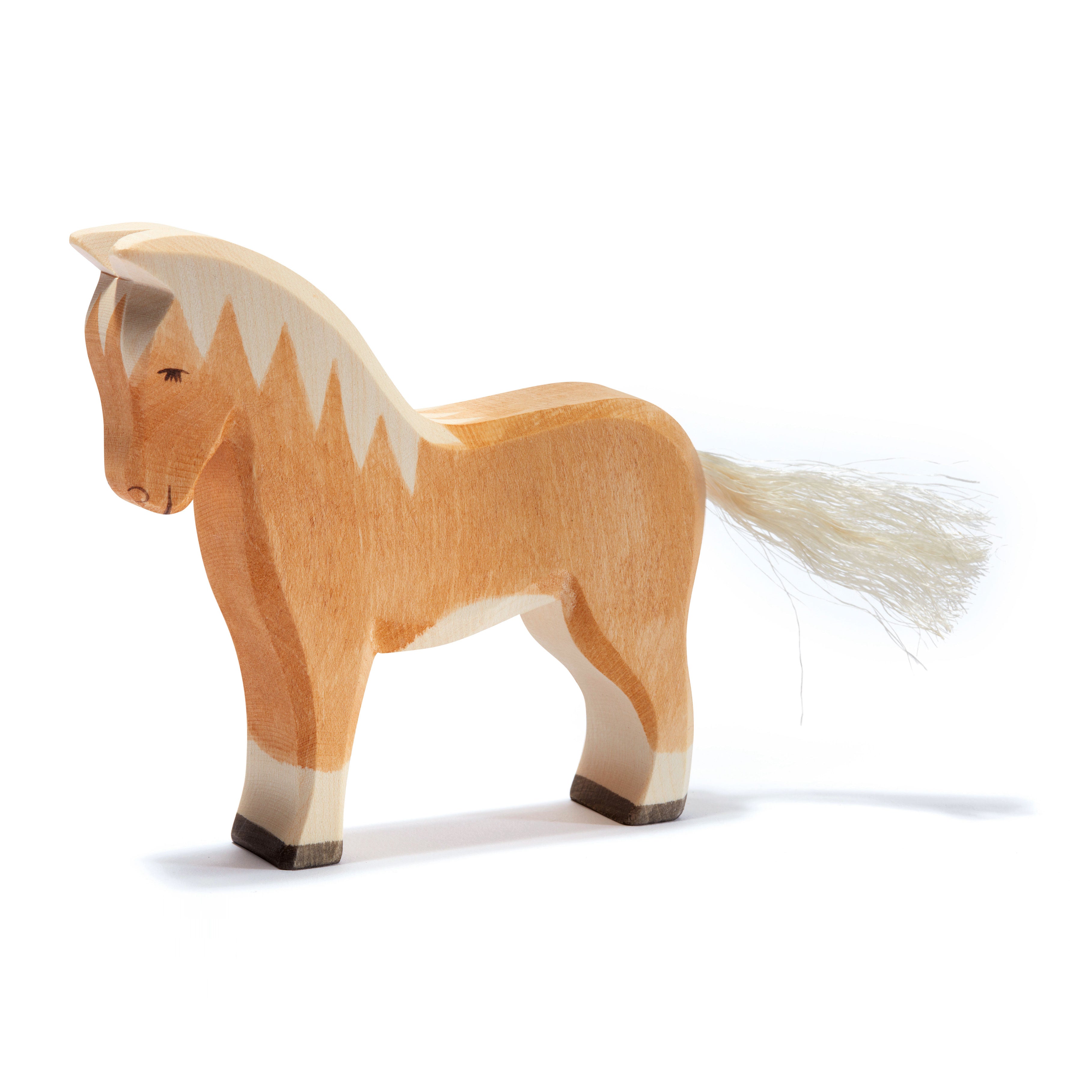 Handmade Ostheimer Haflinger Horse wooden toy with light brown coat and blonde mane, perfect for imaginative play.
