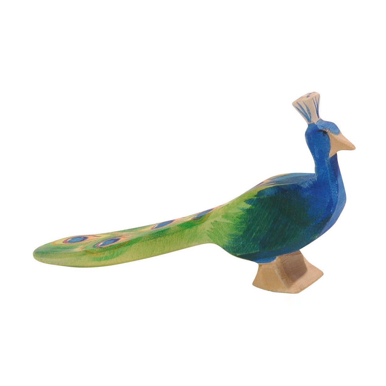 Handcrafted Ostheimer wooden peacock with deep blue plumage and a delicate crown, made from sustainable wood. A classic, open-ended toy designed for imaginative play, suitable for children aged 3+.