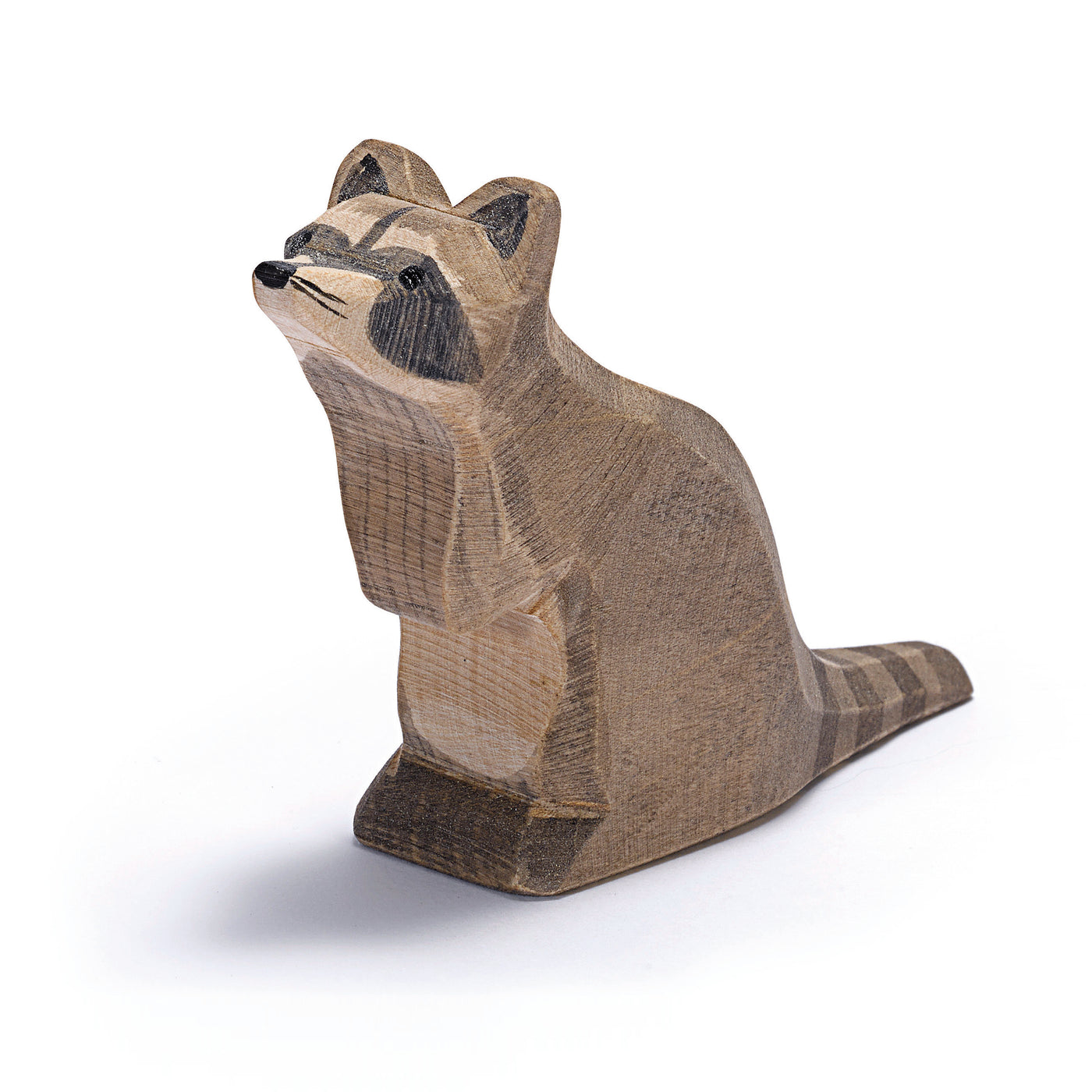 Lively handcrafted wooden raccoon by Ostheimer with distinctive fur pattern, perfect for imaginative play and storytelling