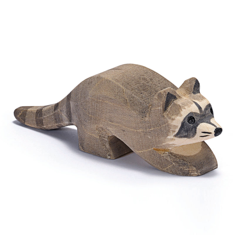 Adorable handcrafted wooden baby raccoon by Ostheimer with mask and striped tail, perfect for imaginative play and storytelling