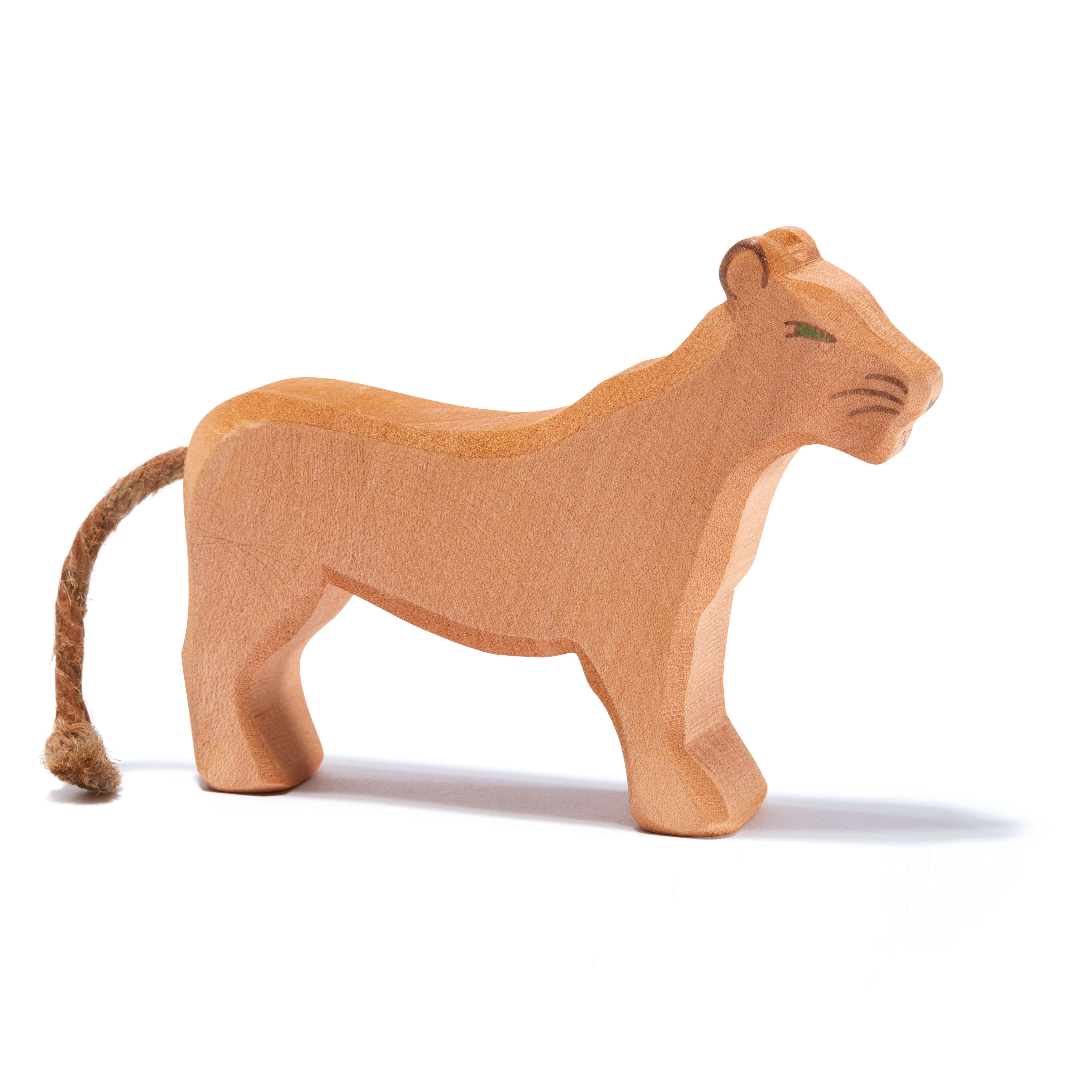 Majestic handcrafted wooden lioness by Ostheimer, symbolizing strength and care, perfect for imaginative play and storytelling