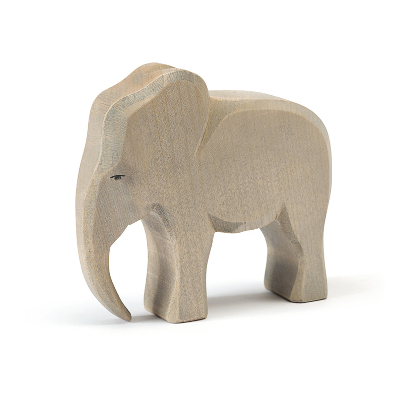 Handcrafted wooden elephant cow by Ostheimer, representing nurturing family bonds, perfect for wildlife-themed imaginative play