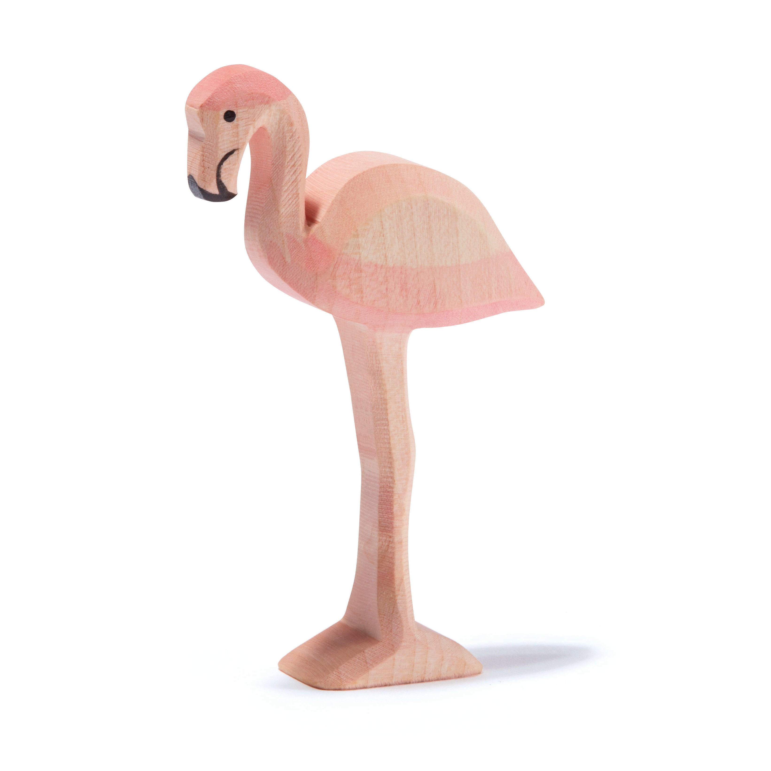 Graceful handcrafted wooden flamingo by Ostheimer in soft pink tones, ideal for imaginative play and storytelling