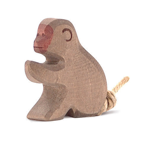 Playful handcrafted wooden baboon by Ostheimer, ideal for imaginative play and wildlife-themed storytelling