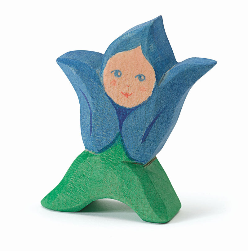 Handcrafted wooden gentian flower child figurine – eco-conscious toy and seasonal decoration.