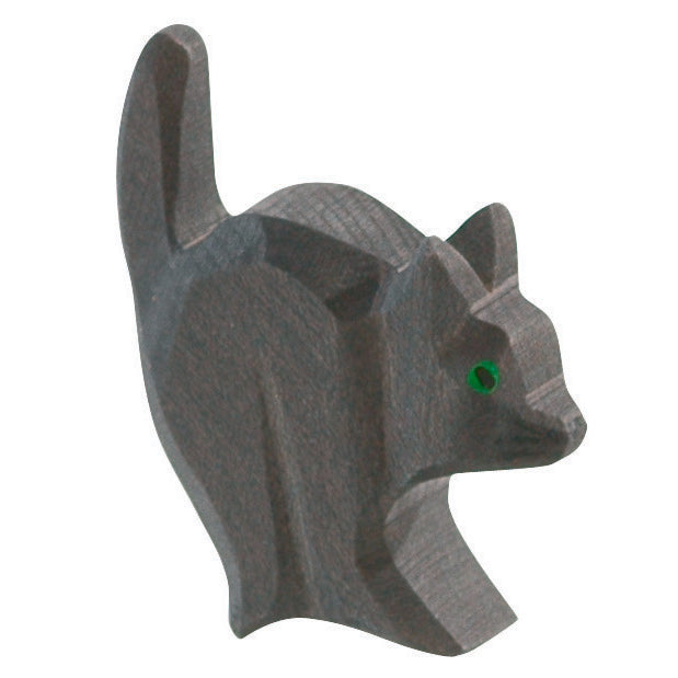 Handcrafted wooden cat for witch by Ostheimer with green eyes and dynamic pose, perfect for imaginative play and storytelling