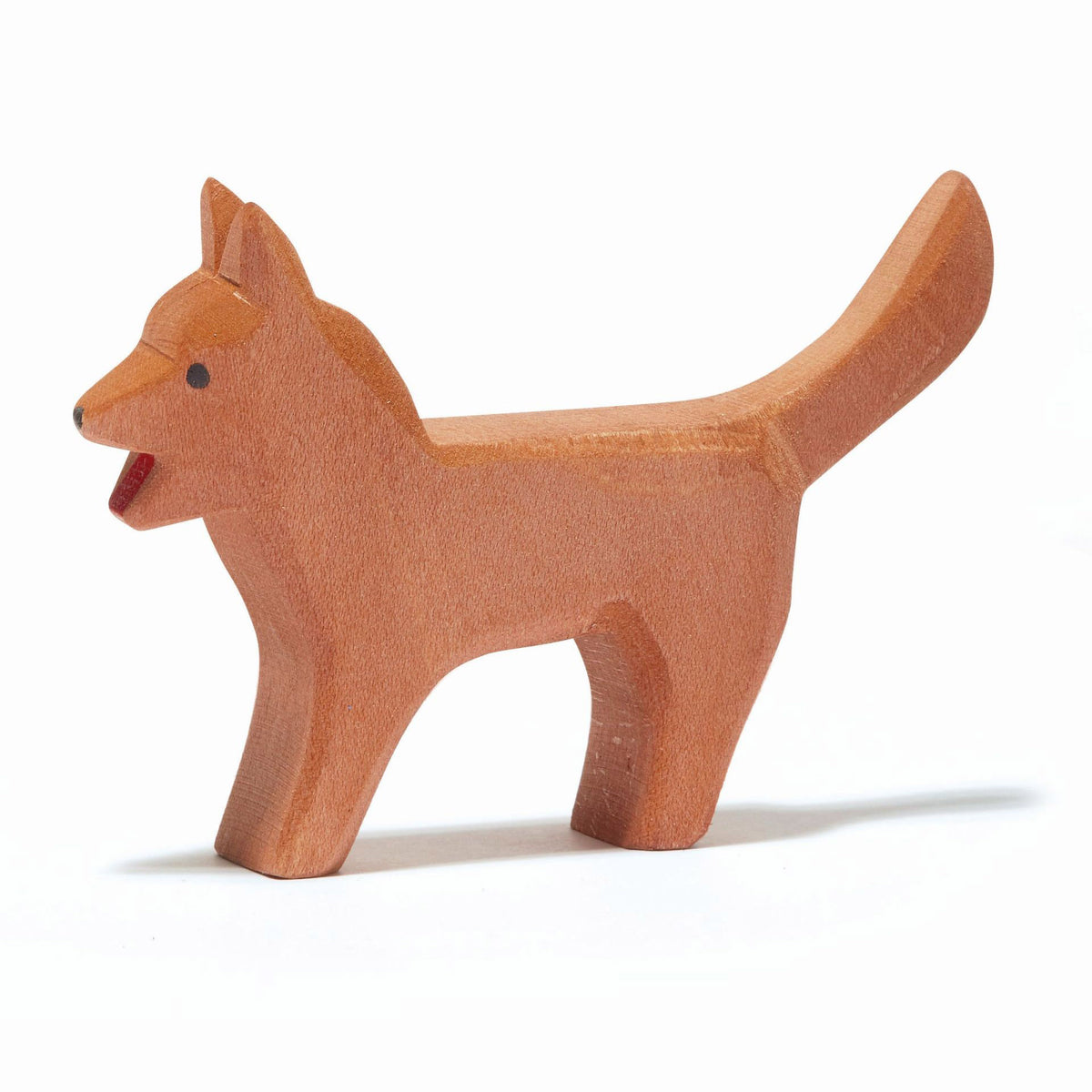 Handcrafted wooden dog by Ostheimer, standing on the donkey and barking as part of the Town Musicians of Bremen