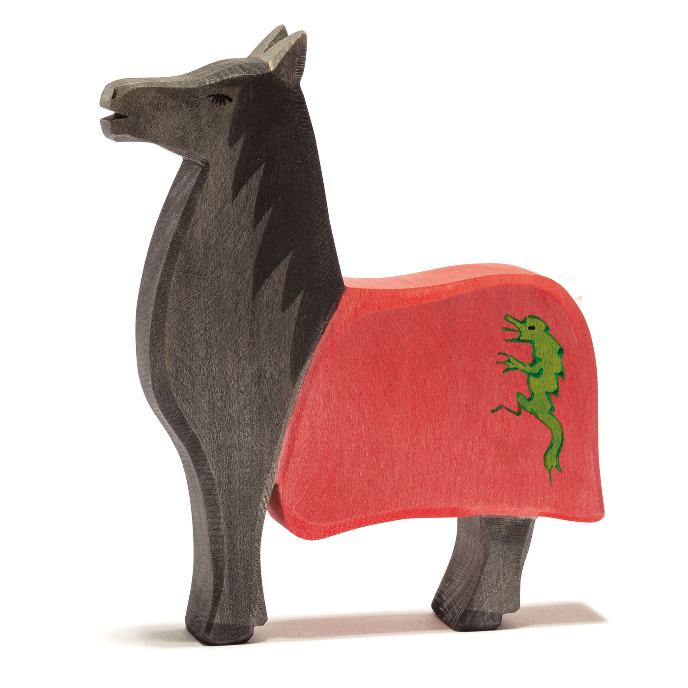 Handcrafted wooden black knight's horse by Ostheimer with a red saddle cloth and green lion emblem, perfect for medieval-themed imaginative play