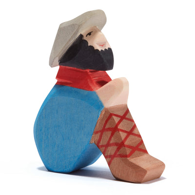 Ostheimer handcrafted wooden figure of a sitting shepherd, perfect for nativity displays or storytelling. Made from sustainable wood and painted with non-toxic colors.