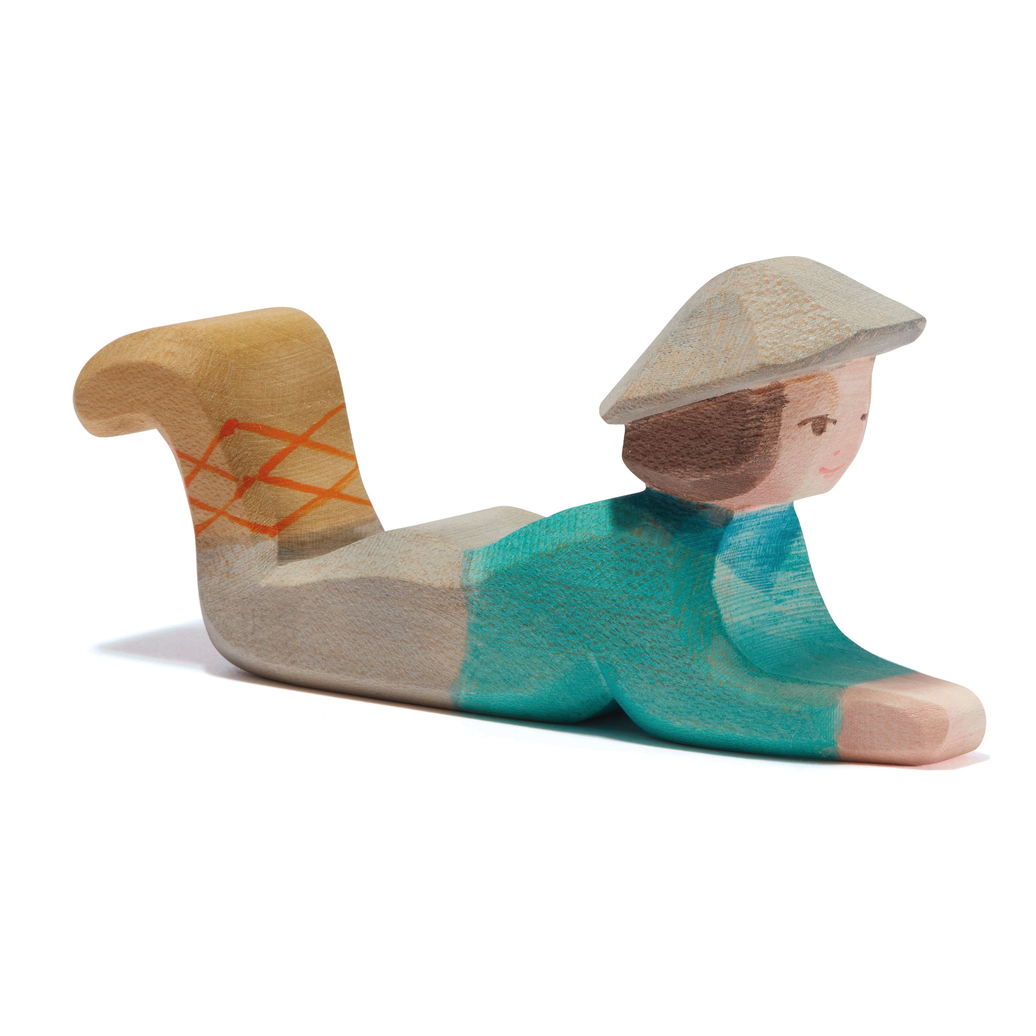 Ostheimer handcrafted wooden figure of a shepherd lying down, ideal for nativity displays or storytelling. Made from sustainable wood and non-toxic paints.