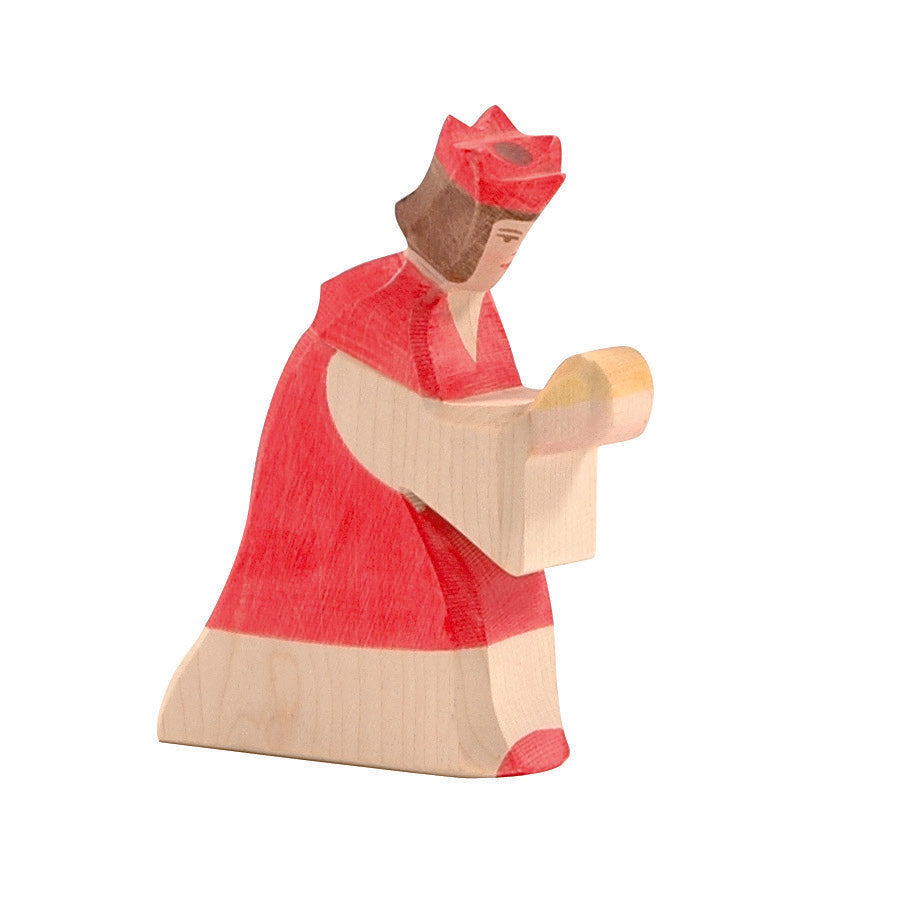 Handcrafted Ostheimer Red King wooden figure with natural red tones, ideal for Nativity displays and holiday storytelling.