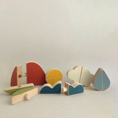 Earth Air and Water Puzzle Toy featuring mountain, cloud, and leaf shapes. Handcrafted from FSC-certified beech wood with non-toxic paints. Inspires sensory exploration and fine motor skills.