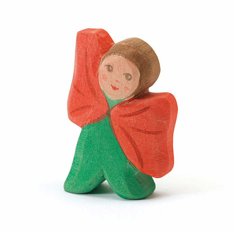 Hand-painted wooden poppy flower child figurine – sustainable toy and seasonal decoration.
