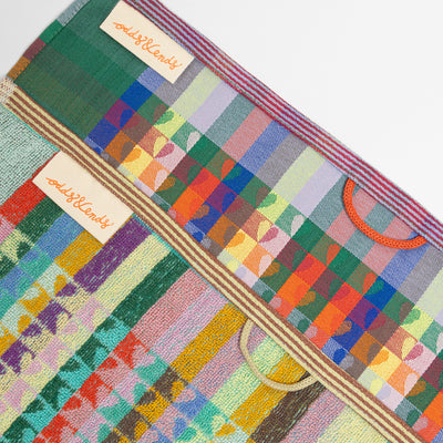 Foekje Fleur Odds & Ends kitchen textile set with 1 tea towel and 1 kitchen towel, made from leftover dyed yarns, sustainable cotton towels with vibrant multicolor design, eco-friendly home textiles made in Portugal