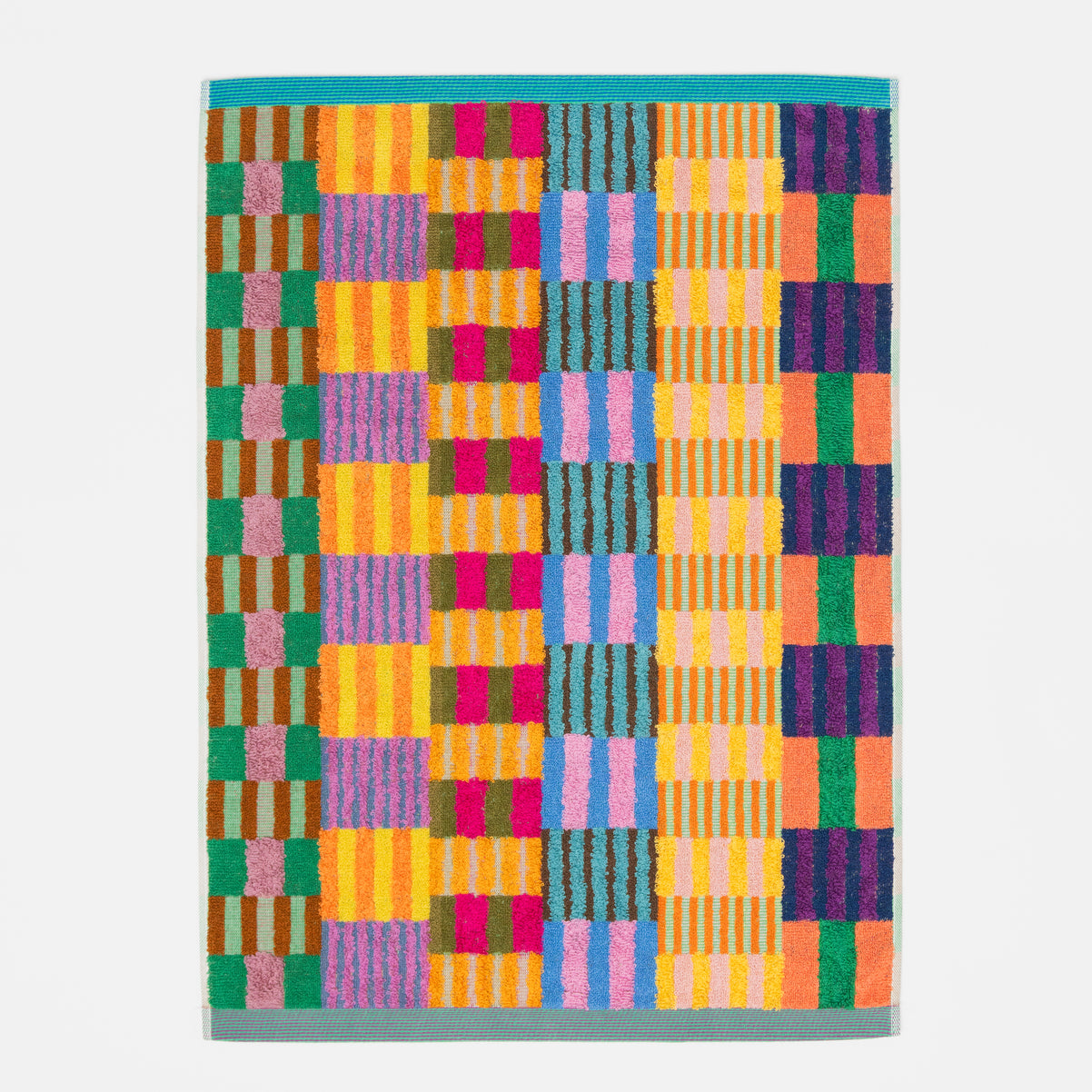 Colorful bath mat number 49 tulip quilt, made from recycled dyed cotton yarns in a unique tulip quilt pattern. Heavyweight, soft, and eco-friendly—designed by Foekje Fleur and made in Portugal. 