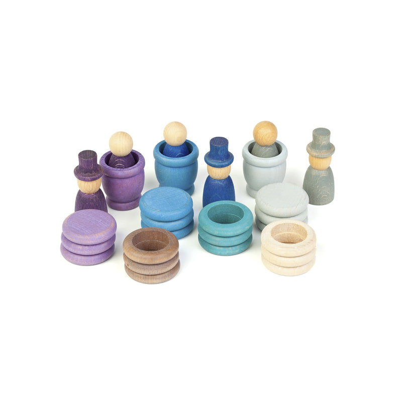 Handcrafted wooden Grapat Aguamarina Winter play set featuring Nins, rings, coins, and mates in cool winter tones.