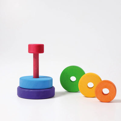 Grimms Disc Tower Small – colorful wooden stacking toy made from linden wood, ideal for developing motor skills