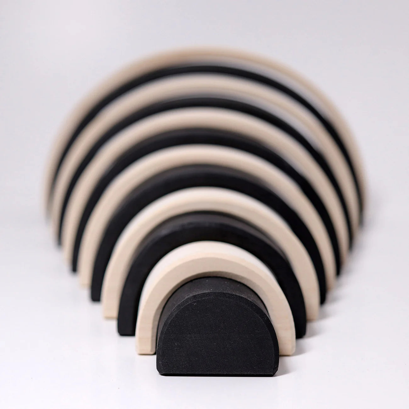 Grimms Large Monochrome Rainbow – 12-piece wooden stacking toy in black, white, and gray tones, handcrafted from linden wood