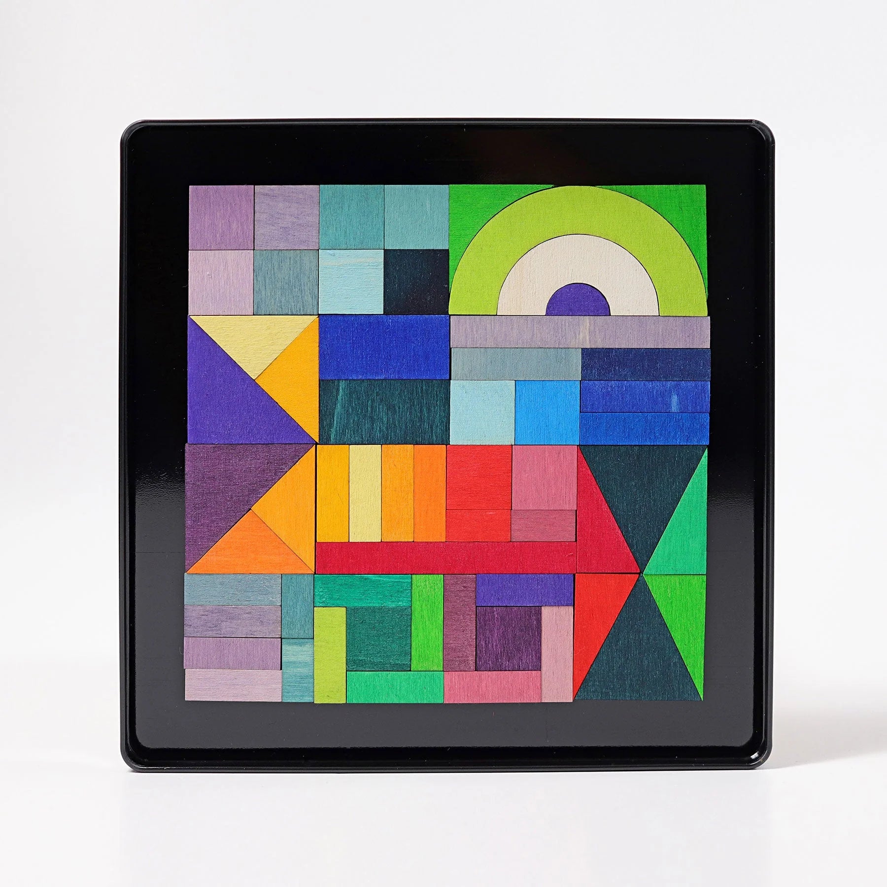Grimms Magnetic Puzzle Graphic Shapes – 59 colorful wooden magnetic pieces in metal box, perfect for creative pattern design and play