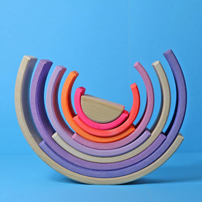 Grimms Neon Rainbow – 10-piece wooden stacking toy in neon and natural tones, handcrafted from linden wood for open-ended creative play