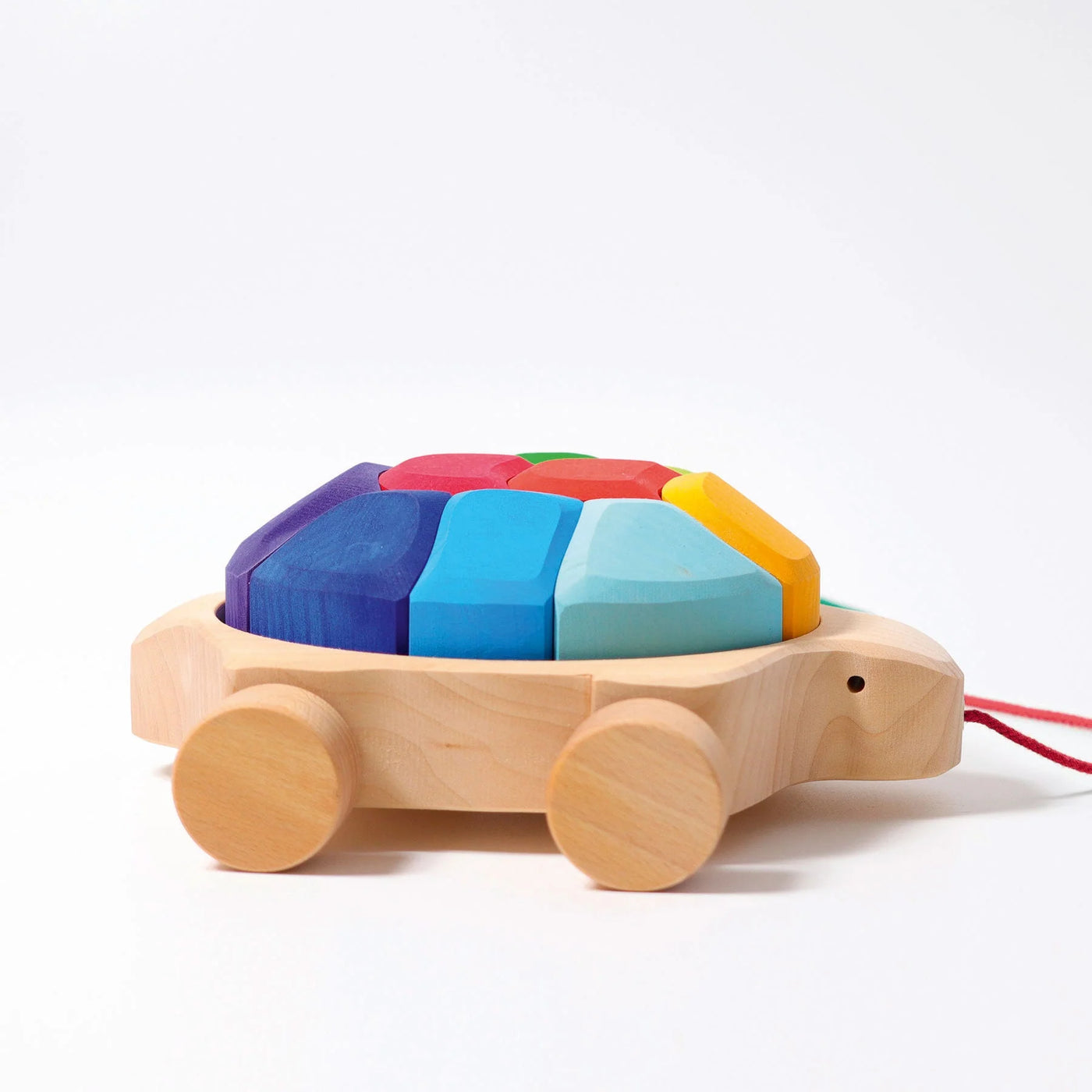Grimms Rainbow Turtle – colorful wooden pull toy with 10 stacking blocks made from basswood, perfect for toddlers learning to walk