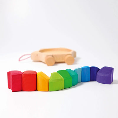 Grimms Rainbow Turtle – colorful wooden pull toy with 10 stacking blocks made from basswood, perfect for toddlers learning to walk