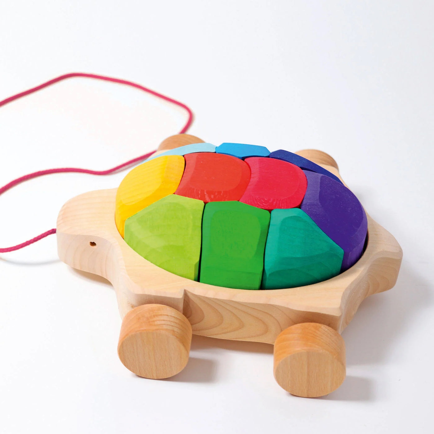 Grimms Rainbow Turtle – colorful wooden pull toy with 10 stacking blocks made from basswood, perfect for toddlers learning to walk
