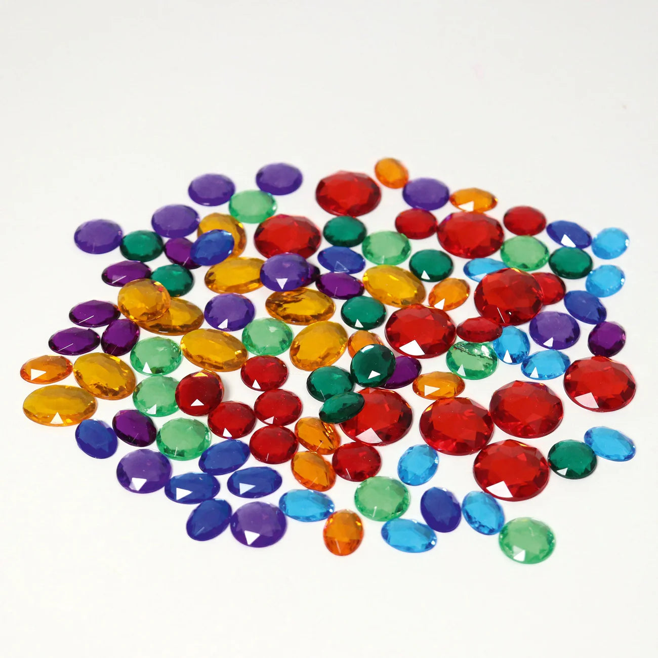 Set of 100 Grimms small acrylic glitter stones in assorted colours inside a palm leaf shell, shimmering loose parts for creative play