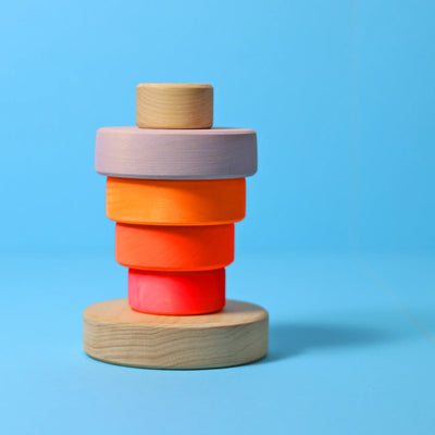Grimms Small Conical Tower Neon Pink – colorful wooden stacking toy with 5 discs, handcrafted from linden wood, promotes fine motor skills