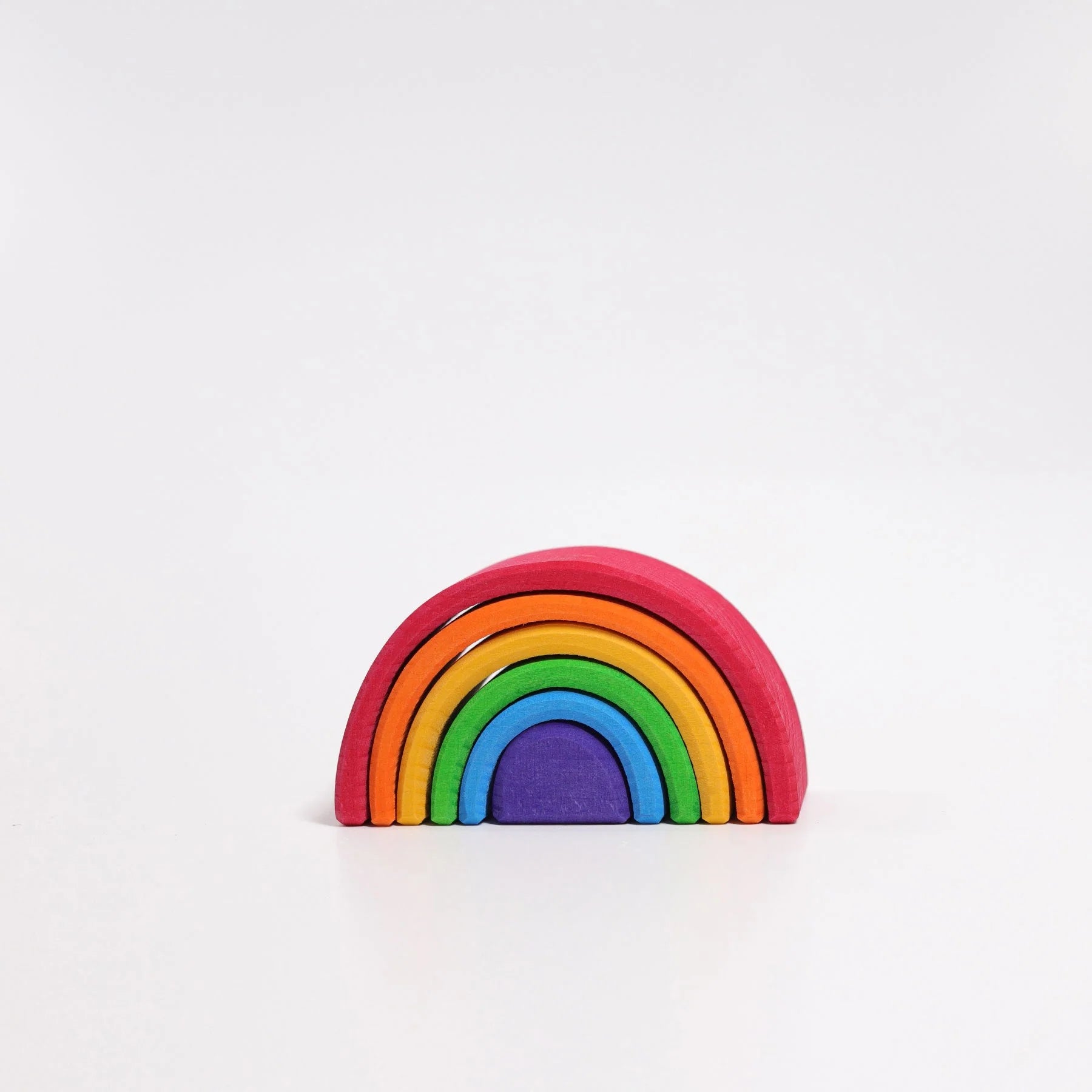 Grimms Small Rainbow Tunnel – colorful 6-piece wooden stacking toy made from lime wood, ideal for creative open-ended play