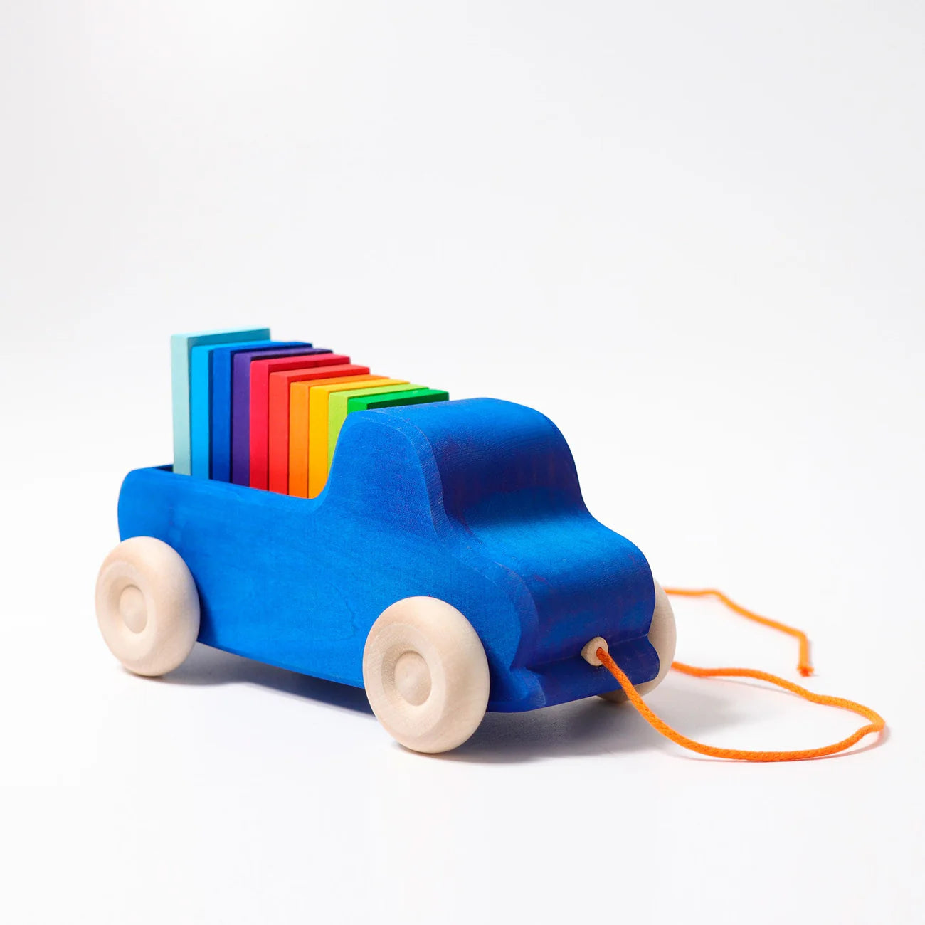 Grimms wooden pull truck with 10 rainbow coloured stacking blocks for toddlers 1+ years
