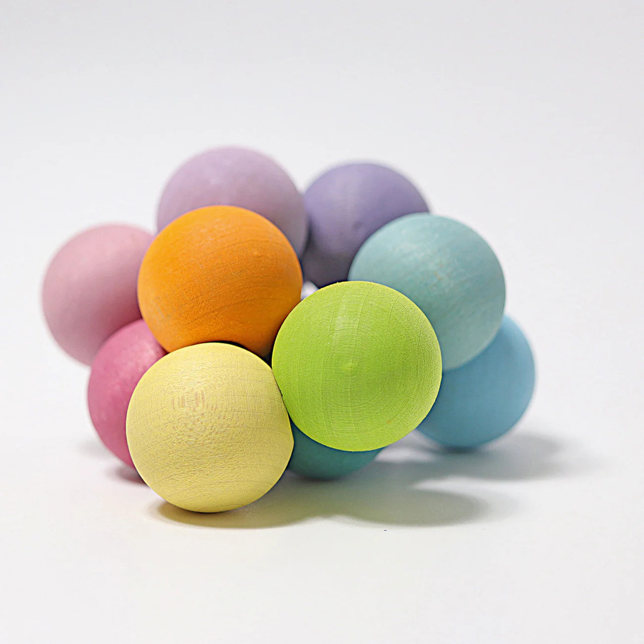 Grimms Pastel Ball Grasping Toy – pastel wooden baby grasping toy made from maple wood for sensory play and early motor development