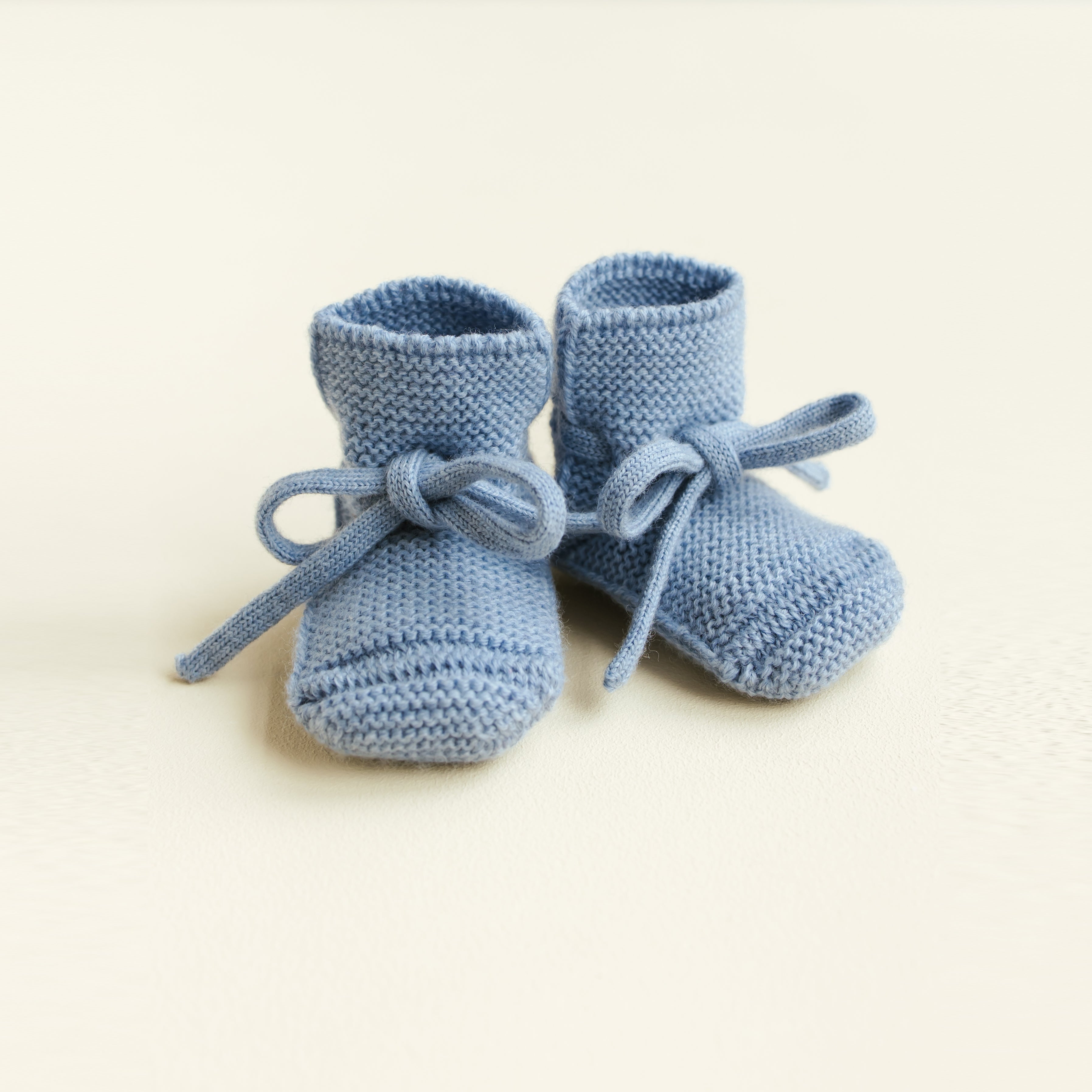 HVID Knitted Baby Booties made of extra fine Italian merino wool in a charming cotton bag