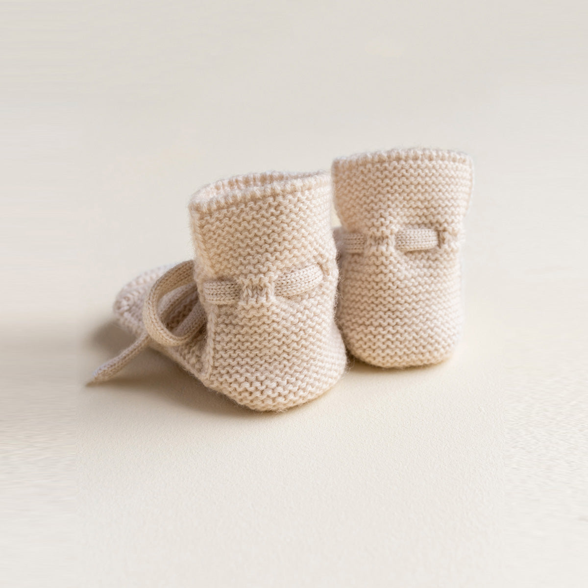 HVID Knitted Baby Booties made of extra fine Italian merino wool in a charming cotton bag
