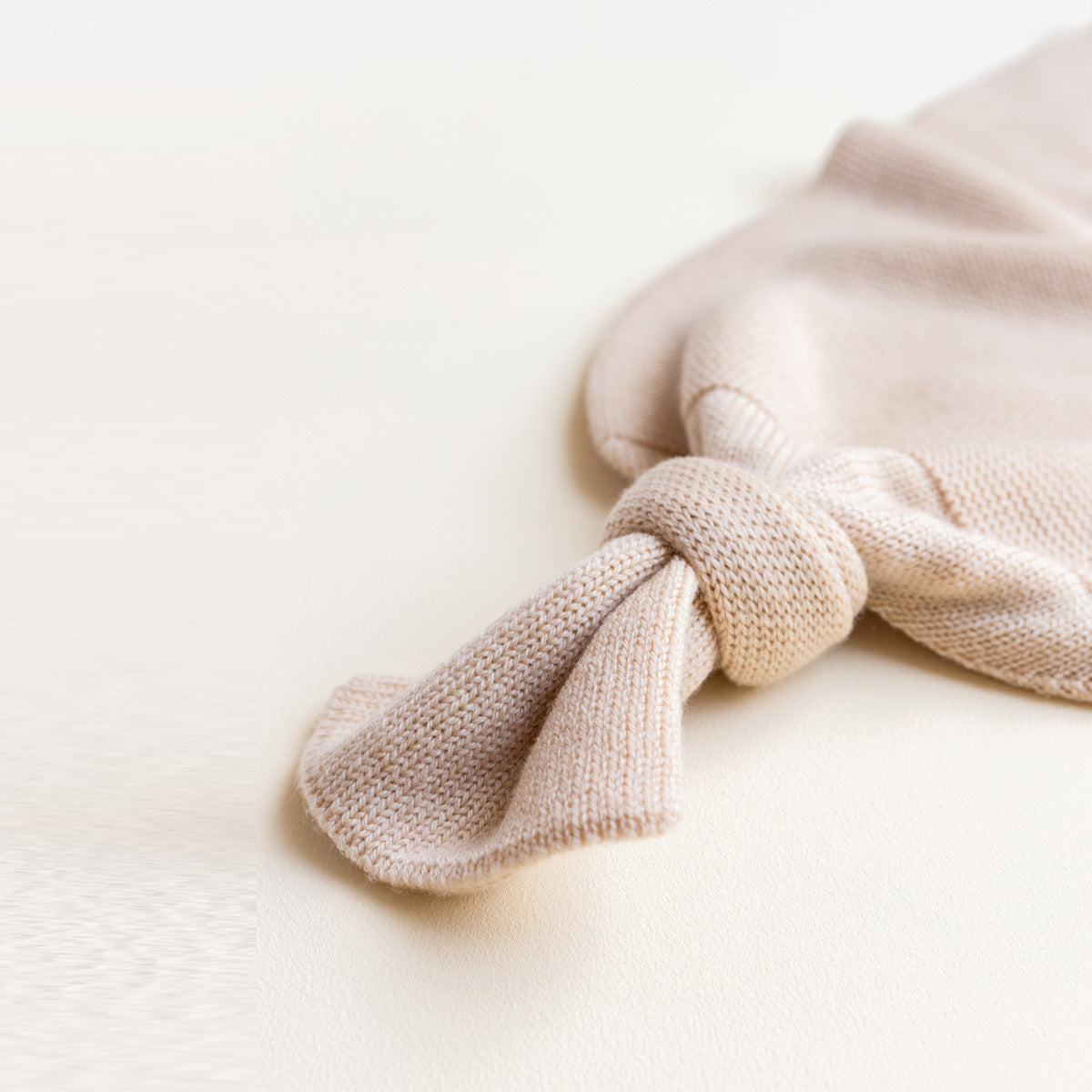 HVID Knitted Baby Cocoon made of 100% extra fine merino wool in neutral tones