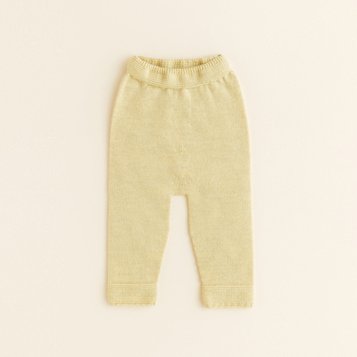 HVID seamless knitted baby pants in extra fine Italian merino wool with a soft elastic waistband and diaper-friendly crotch design in light yellow