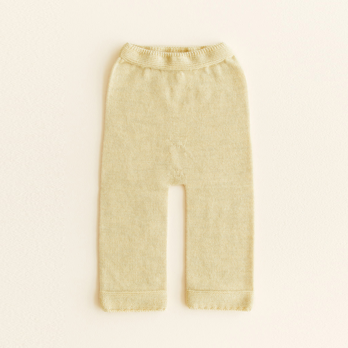 HVID seamless knitted baby pants in extra fine Italian merino wool with a soft elastic waistband and diaper-friendly crotch design in light yellow