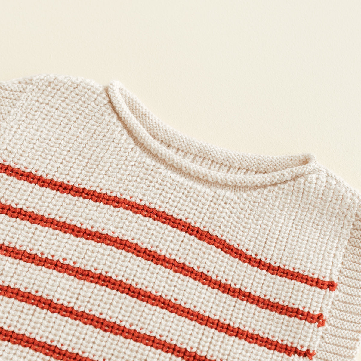 HVID seamless knitted baby vest in extra fine Italian merino wool with a unique stretch collar design for easy dressing in cream with a fine red stripe