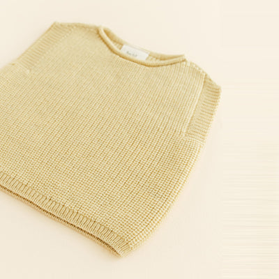 HVID seamless knitted baby vest in extra fine Italian merino wool with a unique stretch collar design for easy dressing in light yellow