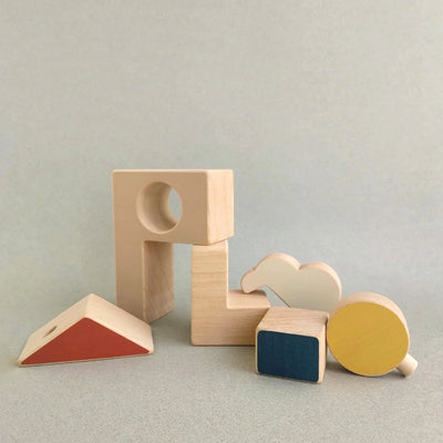 House and Sun Puzzle Toy handcrafted from FSC-certified beech wood with non-toxic paints. Minimalist design with interchangeable shapes to inspire imaginative play and storytelling.