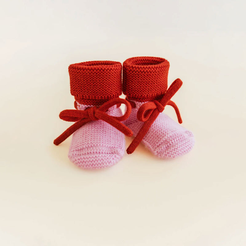 HVID Booties Cotton Candy Red merino wool baby booties with soft knitted design and adjustable tie for newborns and babies