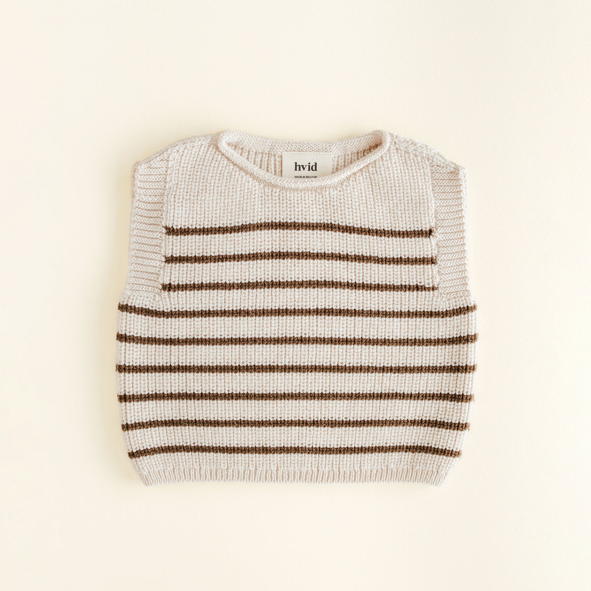 Hvid Vest Harvey in Baby Cream / Mocha – soft merino wool baby vest, seamlessly knitted in Belgium with a flexible neckline for easy dressing and all-day comfort.