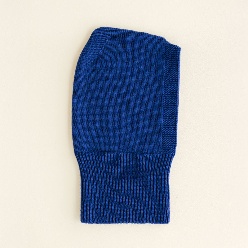 Cobalt blue seamless merino wool balaclava by Hvid, with ribbed neck and soft texture, made in Belgium.