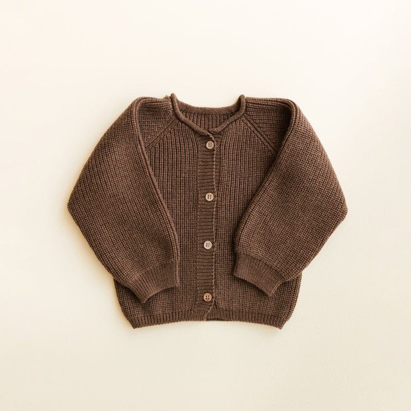 Hvid Cardigan Inga in Mocha – soft merino wool baby cardigan with wooden buttons, seamlessly knitted in Belgium for warmth and comfort.