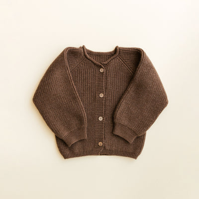 Hvid Cardigan Inga in Mocha – soft merino wool baby cardigan with wooden buttons, seamlessly knitted in Belgium for warmth and comfort.