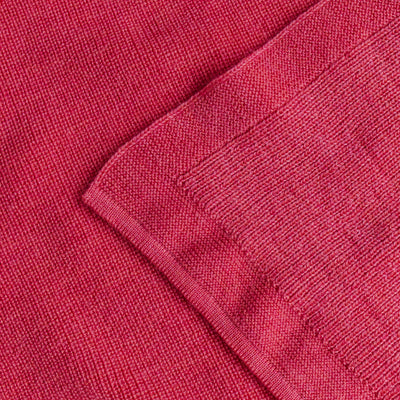 Hvid’s Felix rib-knit baby blanket in lollipop pink, made from 100% extra fine Italian merino wool, perfect for babies and toddlers with sensitive skin