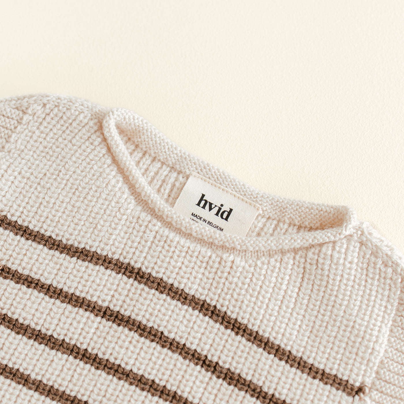 Hvid Vest Harvey in Baby Cream / Mocha – soft merino wool baby vest, seamlessly knitted in Belgium with a flexible neckline for easy dressing and all-day comfort.