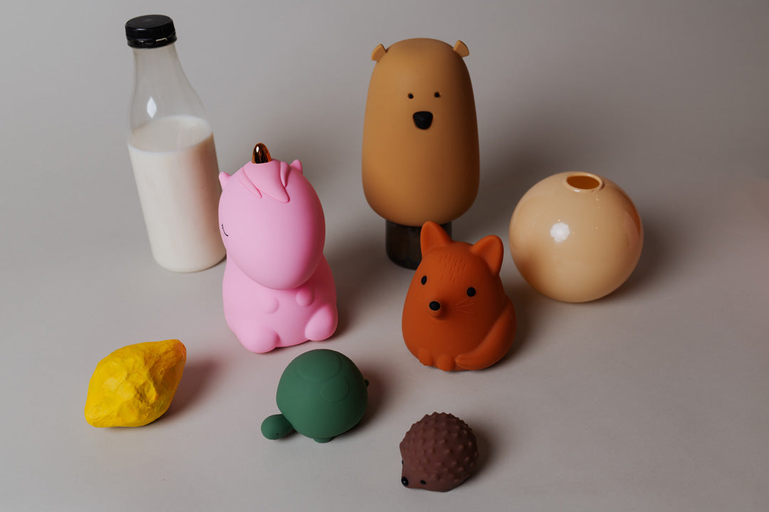 Collection of Le Petit Souk rechargeable night lights in various animal designs displayed together