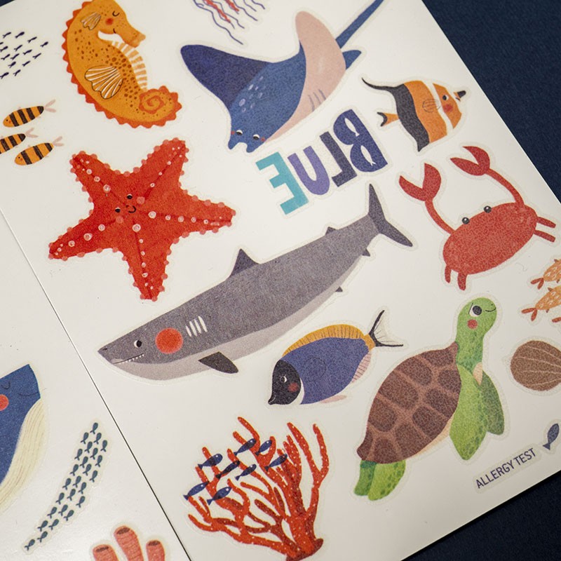Londji Blue Ocean Tattoos Set – children’s temporary tattoos with whales, dolphins and sea animals, safe and non-toxic, made in Barcelona, illustrated by Txell Darné.